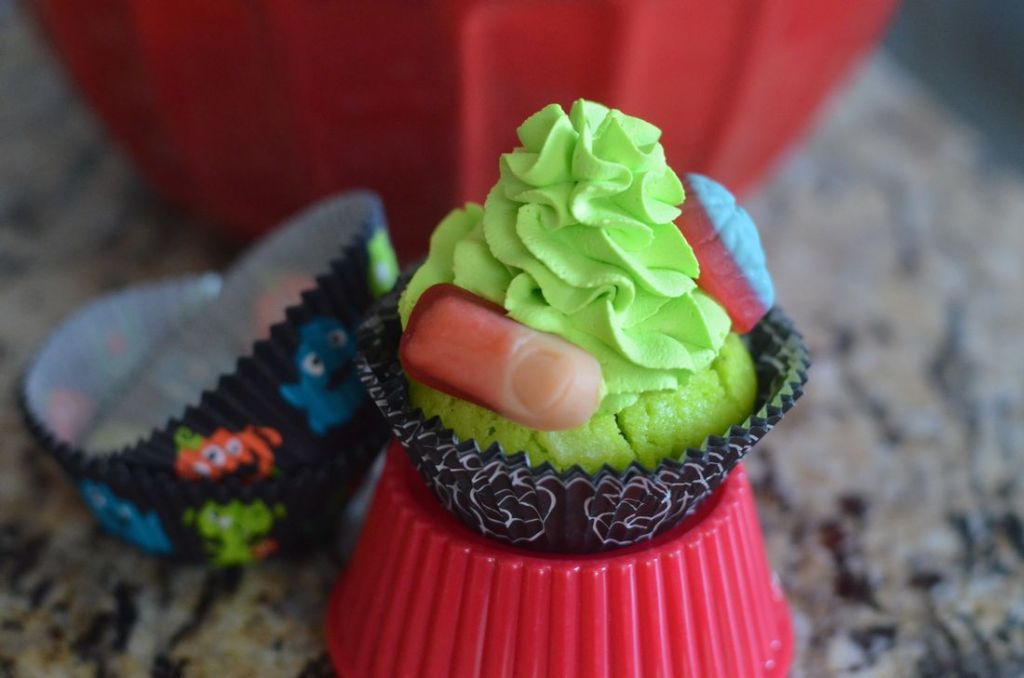 Body Part Cupcakes from Mooshu Jenne. They feature body part gummies with a green whipped topping icing and a yogurt based cupcake.