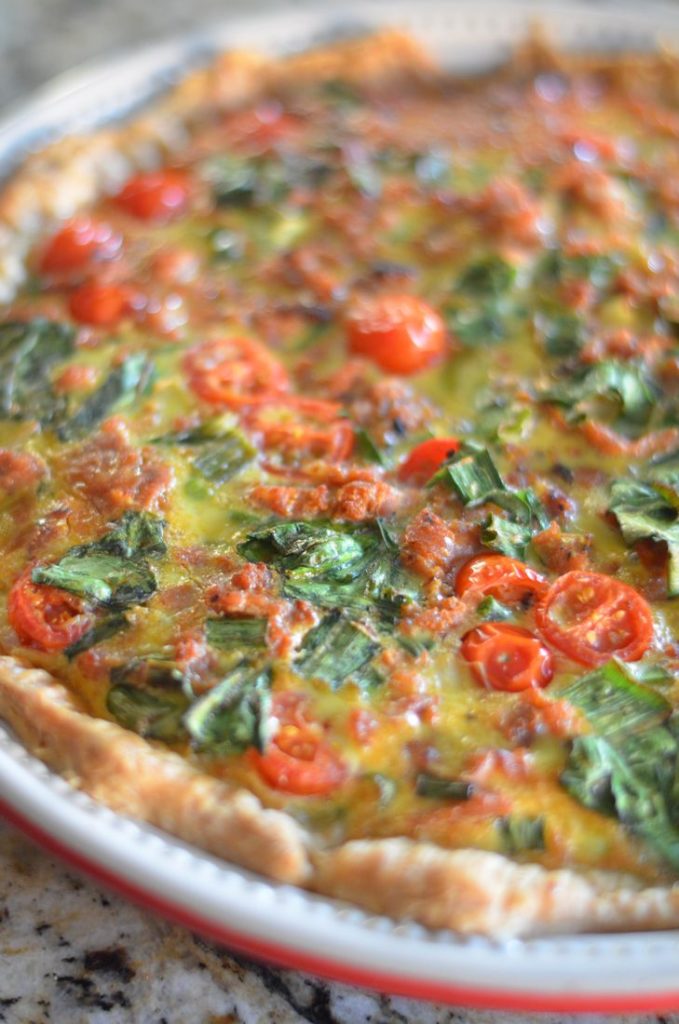 Italian Sausage Tart with spinach, spring onions, tomatoes, egg, and sausage.