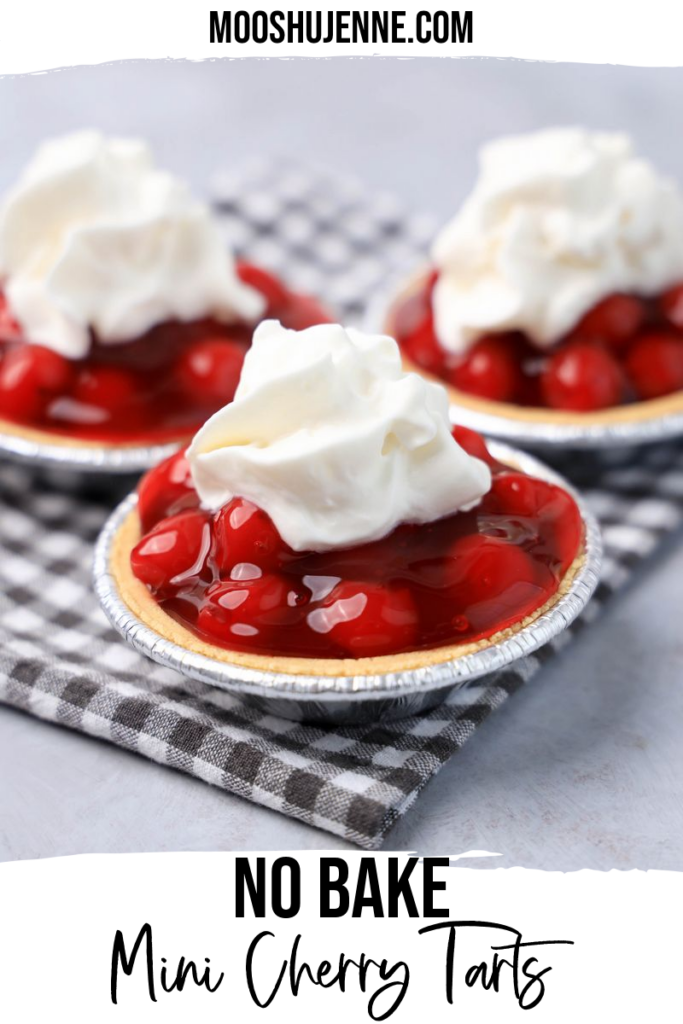 No Bake Mini Cherry Tarts on a gray plaid napkin on a faux concrete backdrop.