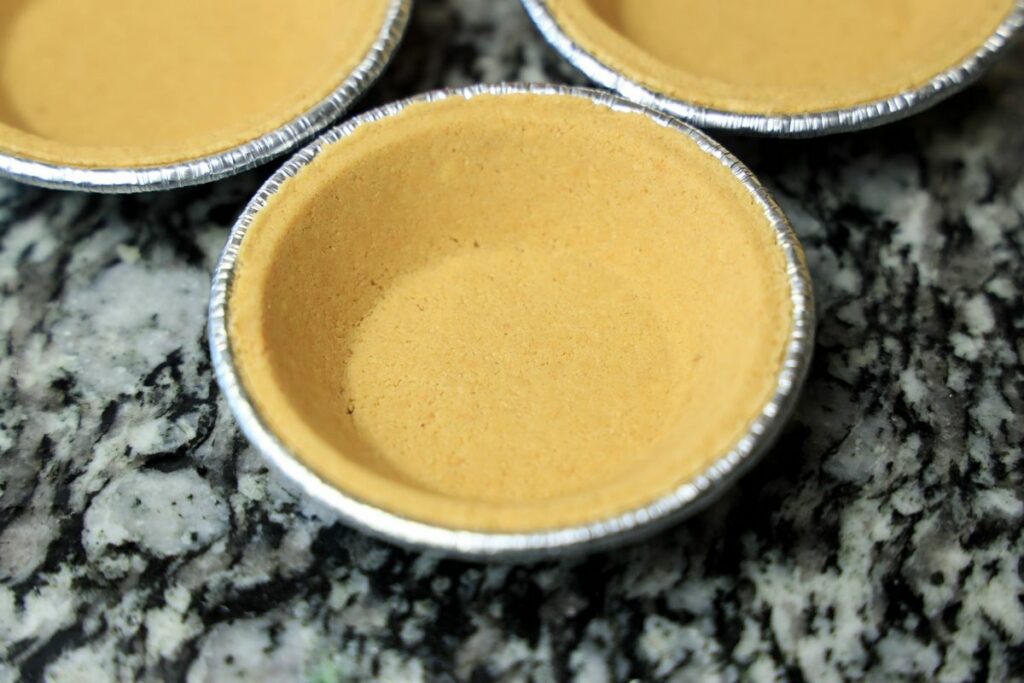 Mini pie crust on the counter top.