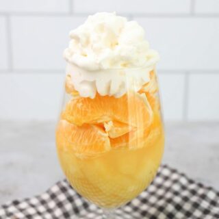 Candy corn parfait with pineapples, oranges and whipped topping.