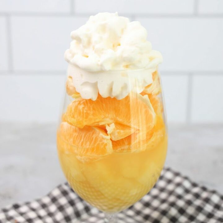 Candy corn parfait with pineapples, oranges and whipped topping.