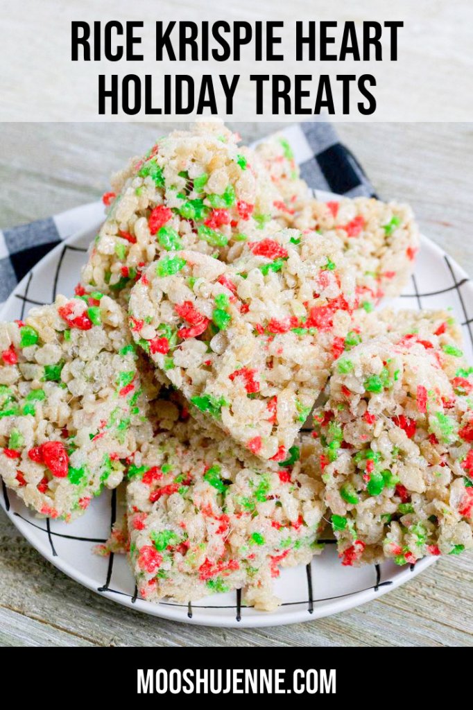 Rice Krispie Heart Holiday Treats made with Rice Kirispies Christmas cereal on a white and black plate