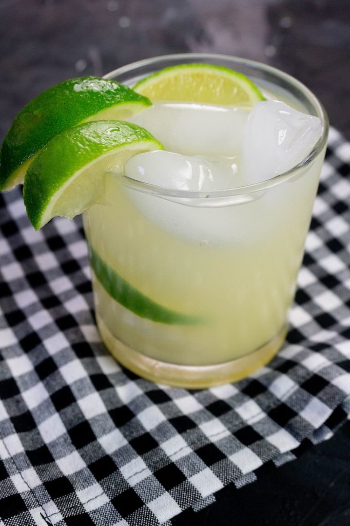 Key Lime Pie Moonshine Cocktail on slate with plaid napkin