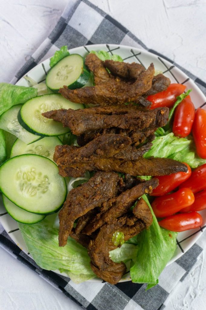 Instant Pot Beef Shawarma with small tomatoes and sliced cucumbers