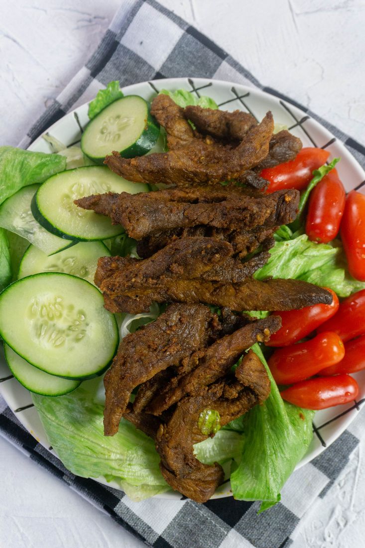 Instant Pot Beef Shawarma with small tomatoes and sliced cucumbers