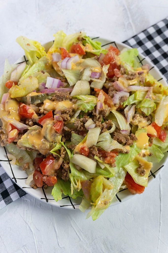 Big mac salad with pickles and tomatoes