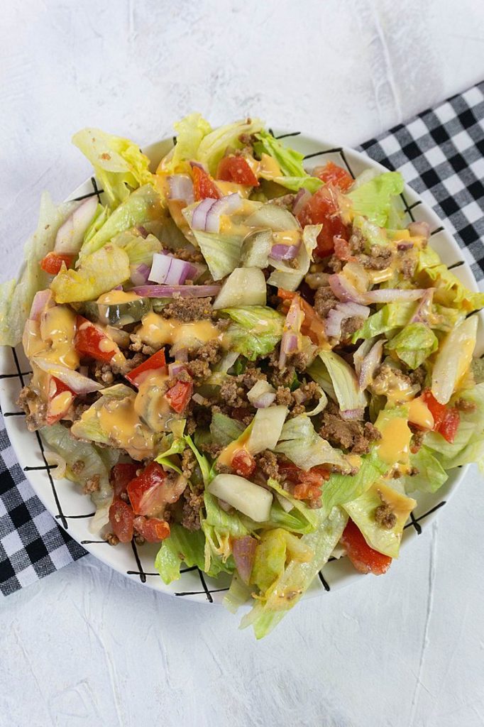 Big Mac Salad with tomatoes, pickles, and onions.