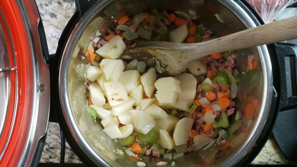 Potatoes, ham, and vegetables inside the instant pot.