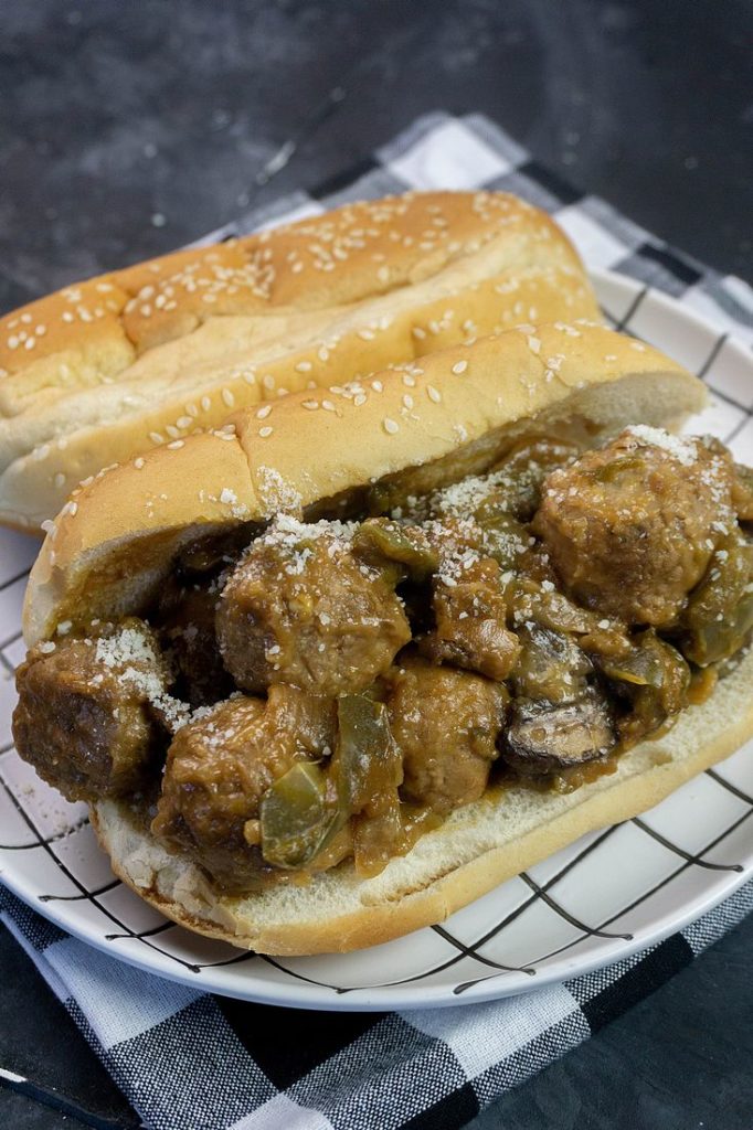 Instant Pot Philly Cheese Steak Meatballs on a white and black plate