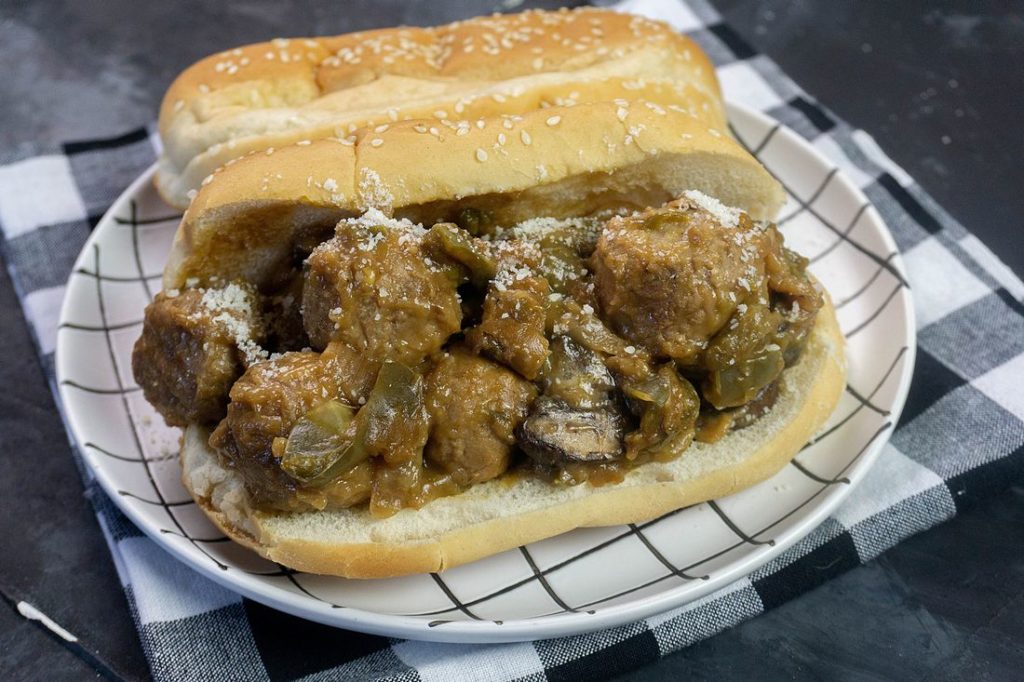 Instant Pot Philly Cheese Steak Meatballs on white plate with plaid napkin