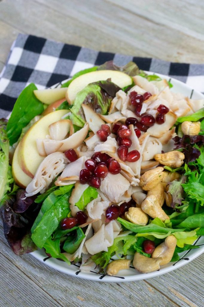 Thanksgiving Fall Harvest Salad on Gray Wood With Plaid Napkin