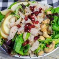 Thanksgiving Fall Harvest Salad on Gray Wood With Plaid Napkin