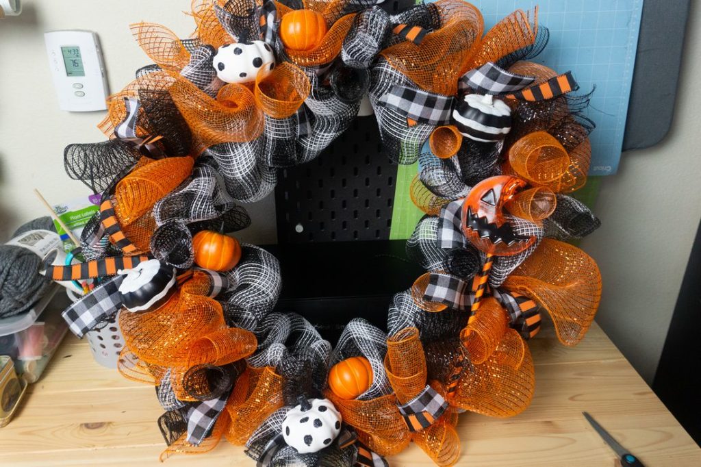 Wreath with pumpkins staged.