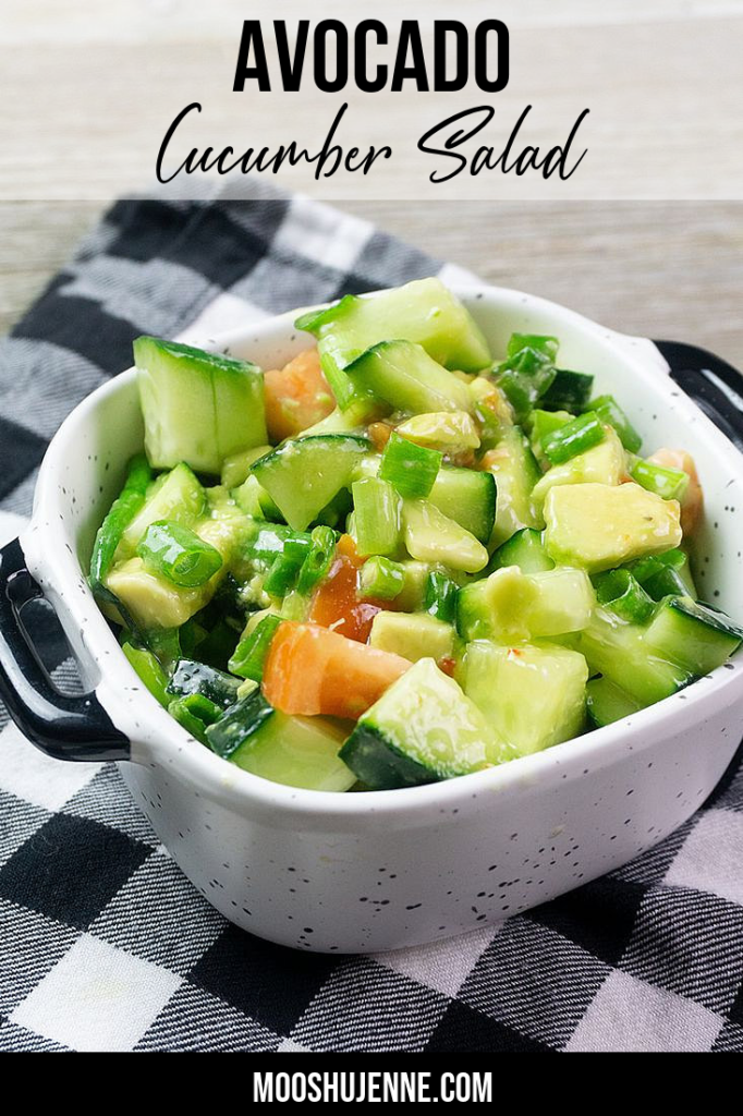 Avocado Cucumber Salad on grey backdrop with black and white plaid napkin