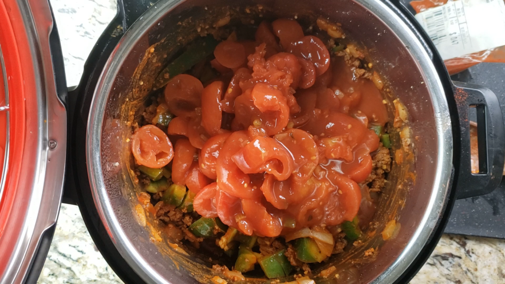 Stewed tomatoes with soup mixture inside the instant pot