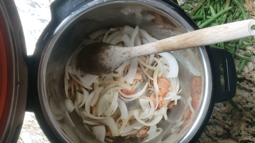 Onions and bacon inside the instant pot