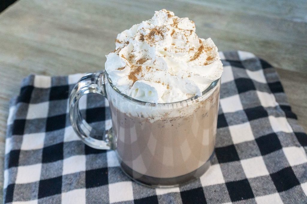 Instant Pot Double Hot Chocolate on grey wood board with plaid napkin