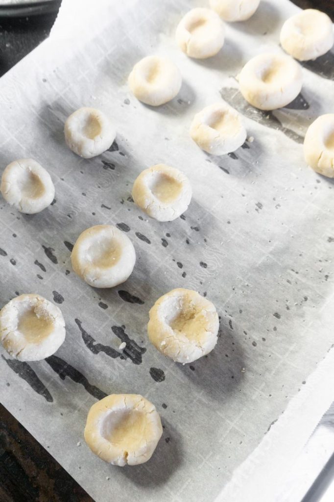 Thumbprint dough on baking sheet