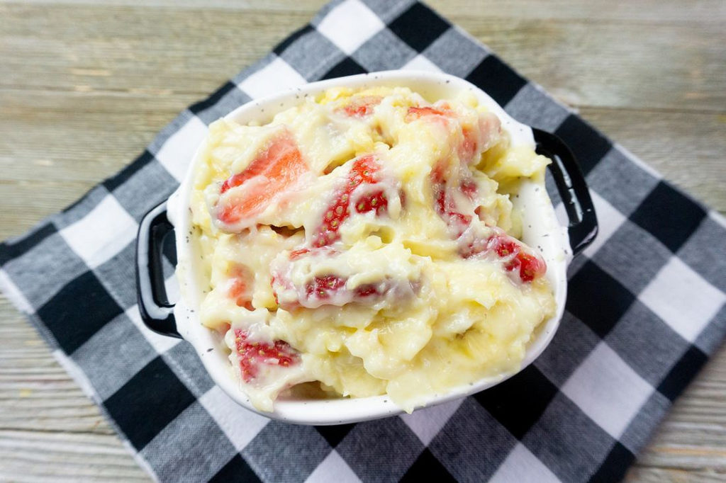 Strawberry Banana Yogurt Delight in a black and white bowl