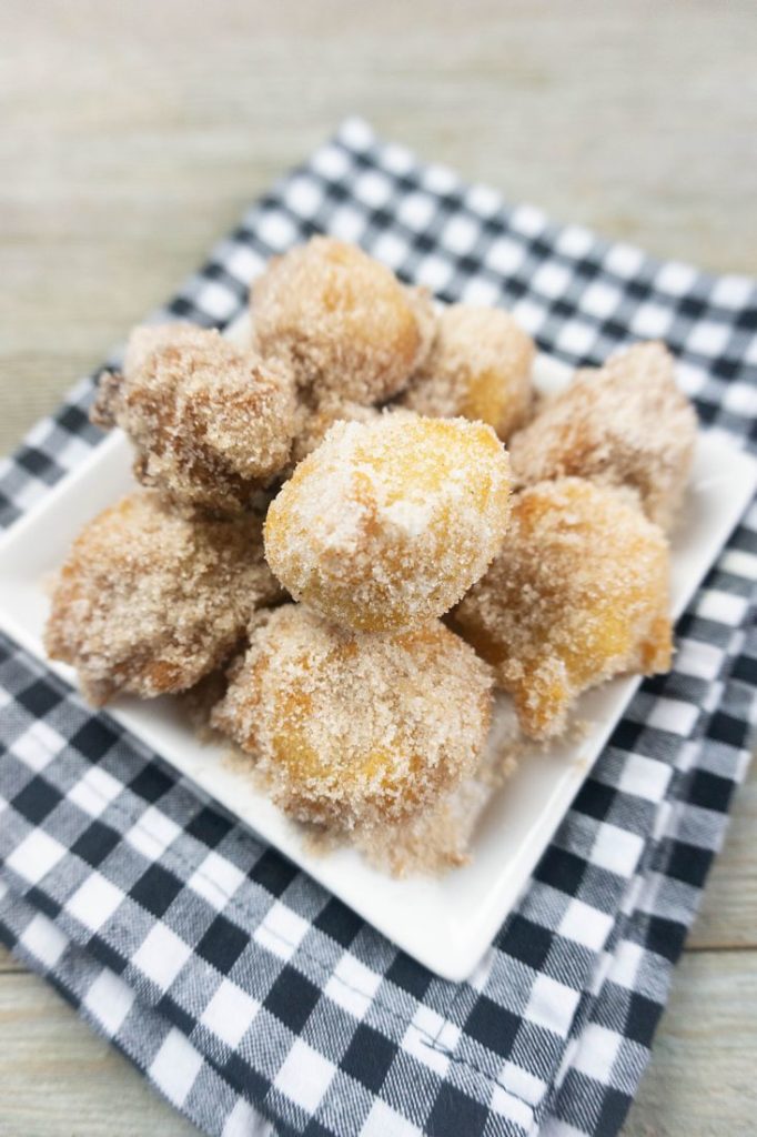 Deep Fried Bananas on a small white late with black and white plaid napkin