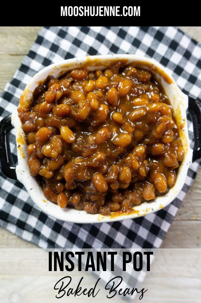 Instant Pot Baked Beans on a wood board in a black and white speckled bowl with black and white plaid napkin