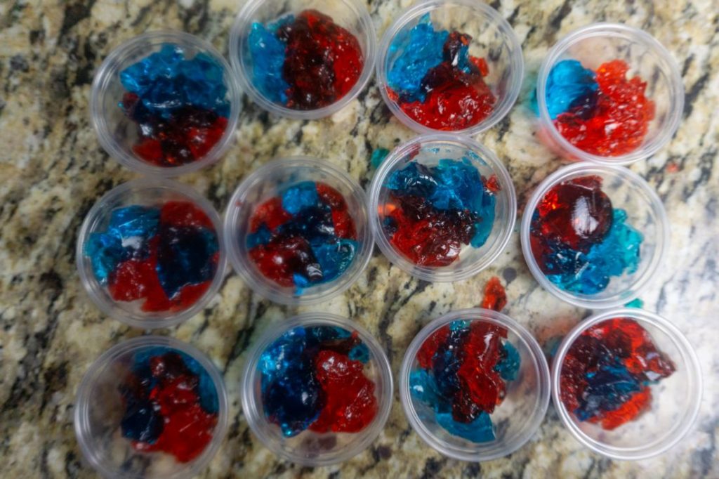 Red and blue jello in jello shot cups