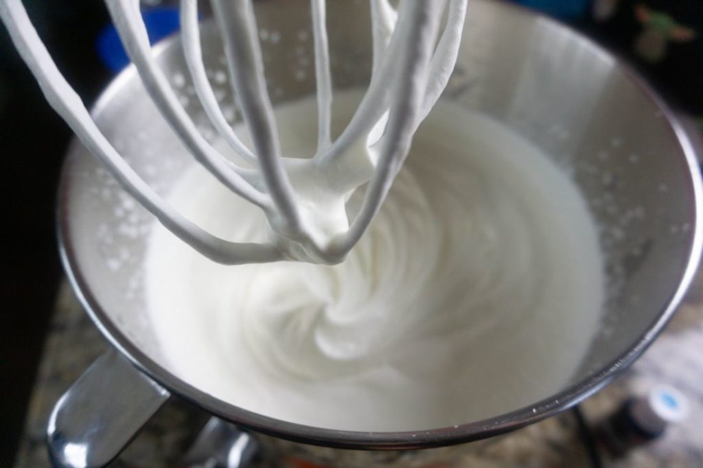 heavy whipping cream inside the kitchen aid mixing bowl