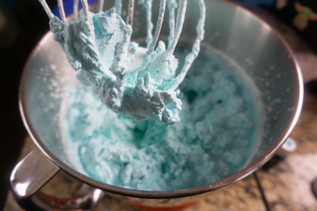 Blue dyed heavy whipping cream whipped in to whipped topping texture