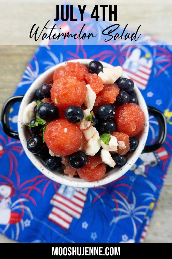 Watermelon, pearl mozzarella, blueberries, and mint in a white bowl on a snoopy cloth napkin