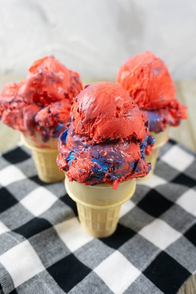 Red White and Blue Ice Cream on a black and white plaid napkin with grey wood underneath