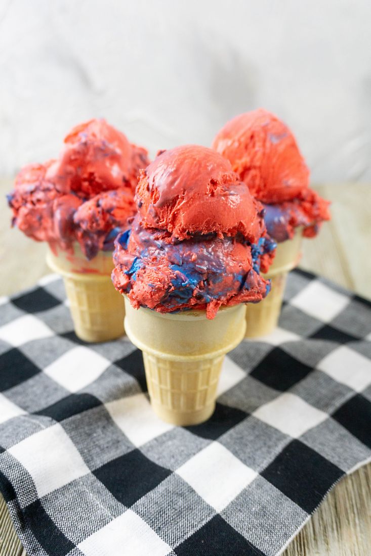 Red White and Blue Ice Cream on a black and white plaid napkin with grey wood underneath