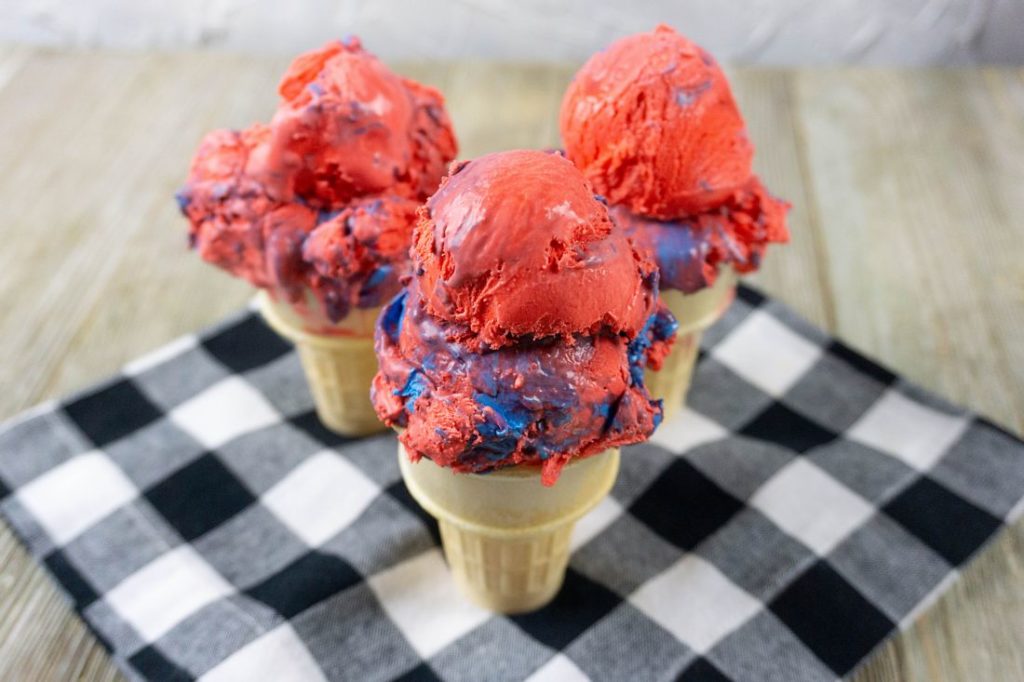 Red White and Blue Ice Cream on a black and white plaid napkin with grey wood underneath
