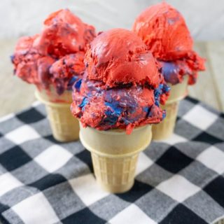 Red White and Blue Ice Cream on a black and white plaid napkin with grey wood underneath