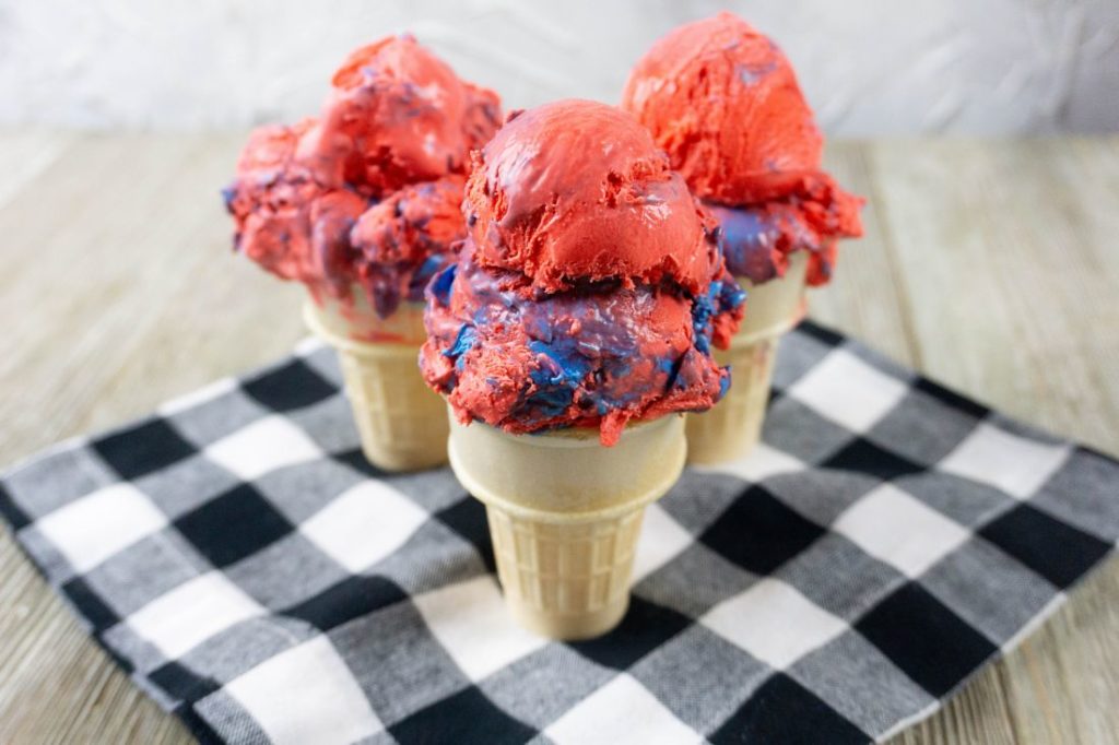 Red White and Blue Ice Cream on a black and white plaid napkin with grey wood underneath