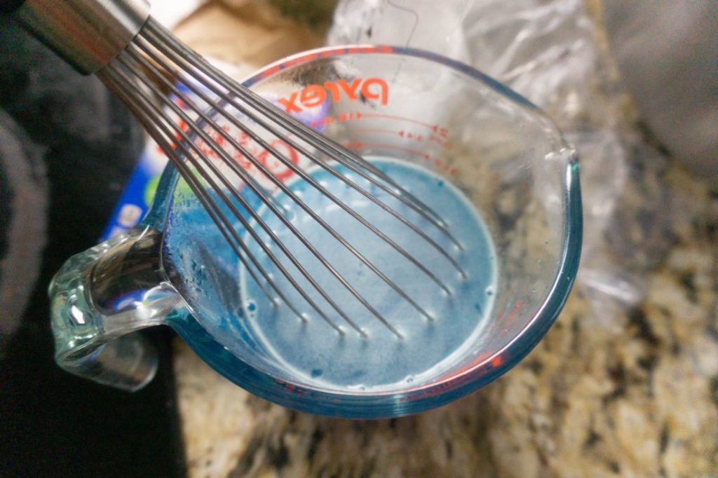 Blue jello in a pyrex bowl