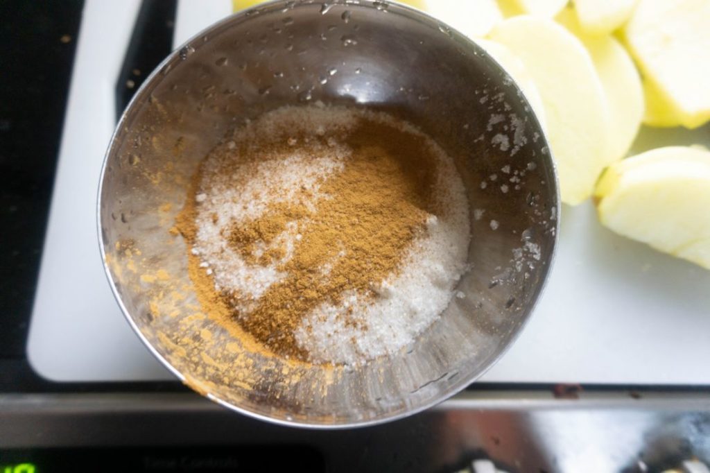 Cinnamon sugar mix in a stainless steel bowl