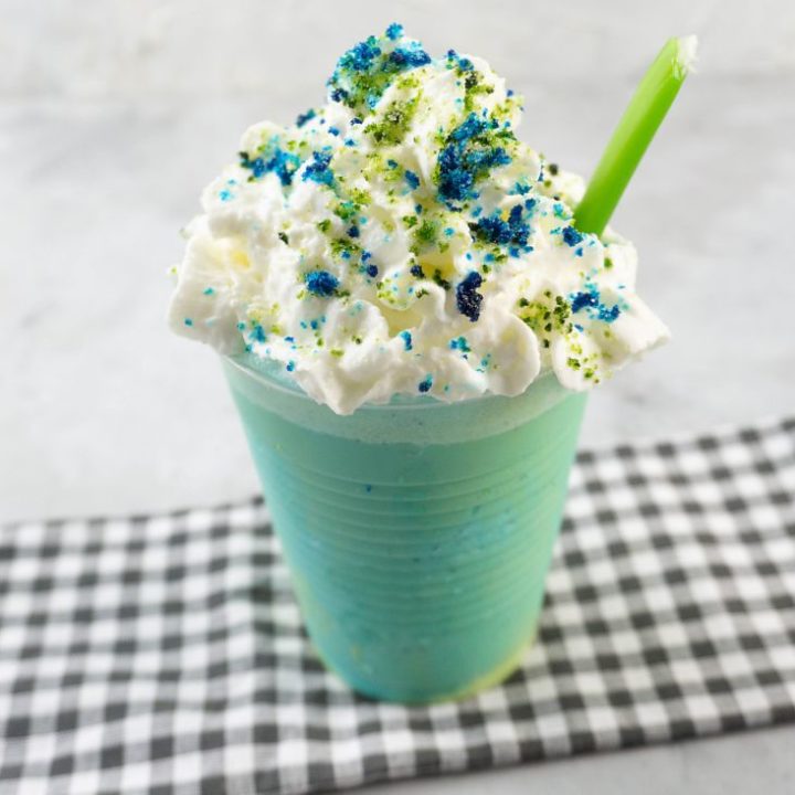 pixar luca frappuccino with green and blue frap ice cream along with whipped topping and green and blue sugars