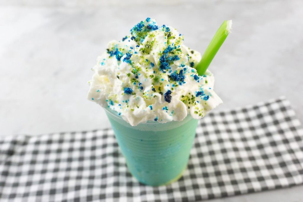 pixar luca frappuccino with green and blue frap ice cream along with whipped topping and green and blue sugars