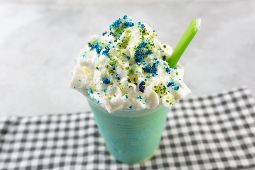 pixar luca frappuccino with green and blue frap ice cream along with whipped topping and green and blue sugars