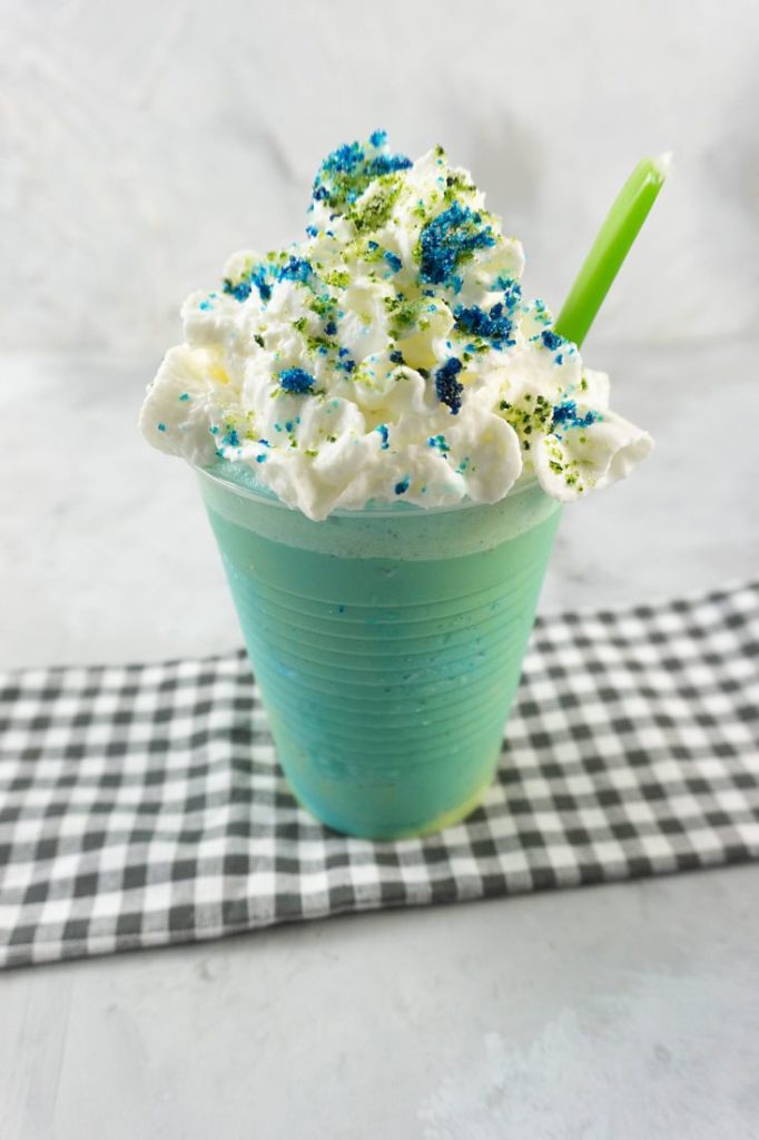 pixar luca frappuccino with green and blue frap ice cream along with whipped topping and green and blue sugars