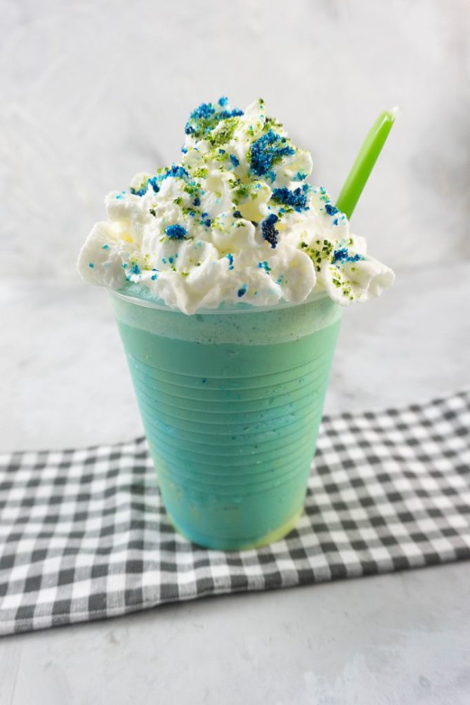 pixar luca frappuccino with green and blue frap ice cream along with whipped topping and green and blue sugars