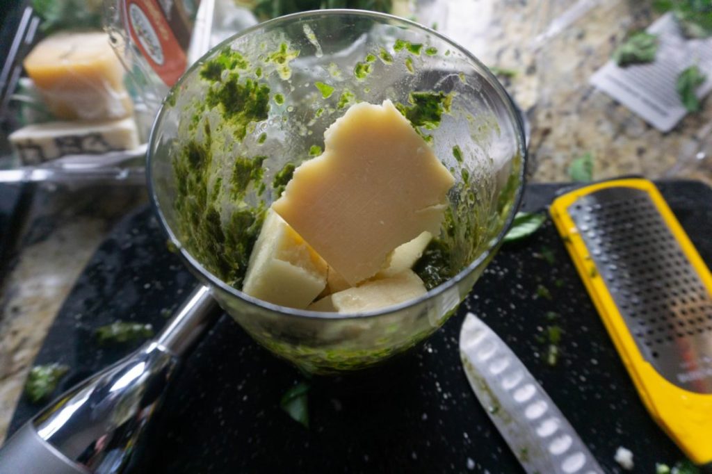 basil pesto with parmesan cheese in a jar