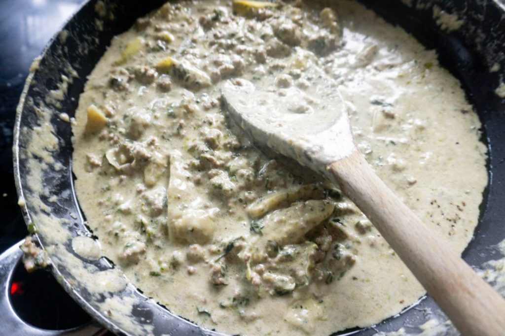 Spinach Artichoke Dip Beef Pasta in a pan