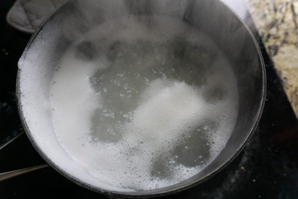Raya Congee rice in pot with water boiling