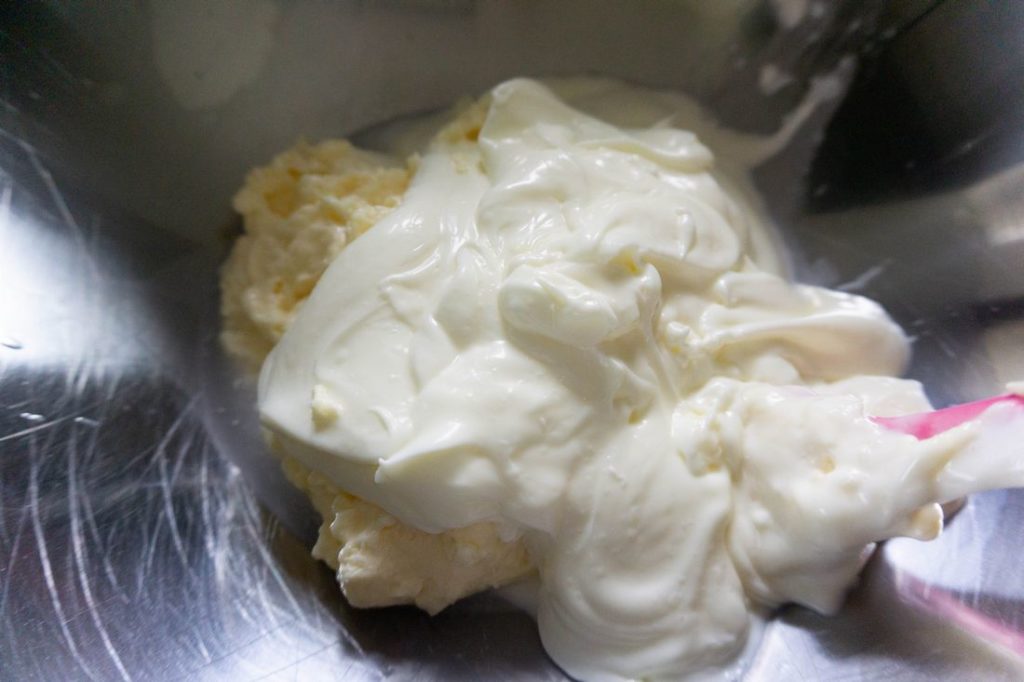 creating the white sauce with mayo in a silver bowl