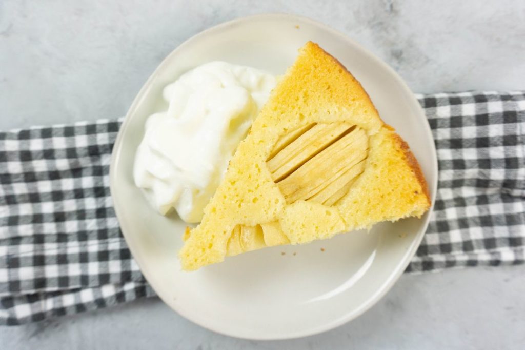 German Apple Coffee Cake with sliced apples on a concrete gray back drop