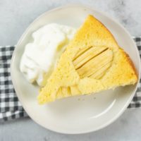 German Apple Coffee Cake with sliced apples on a concrete gray back drop