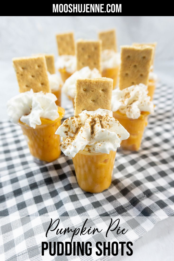 Pumpkin Pie Pudding Shots on a plaid napkin and concrete back drop