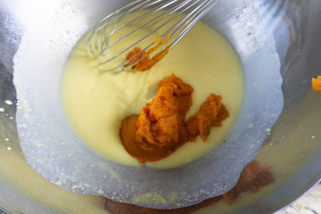 Mixing in the pumpkin puree with the vanilla pudding